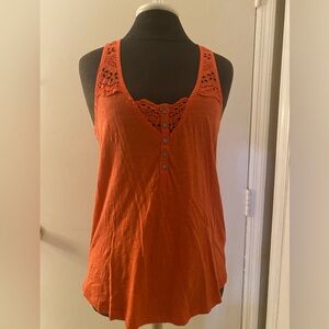 New with tags Lucky Brand orange tank. Very pretty detail on the back. Size S